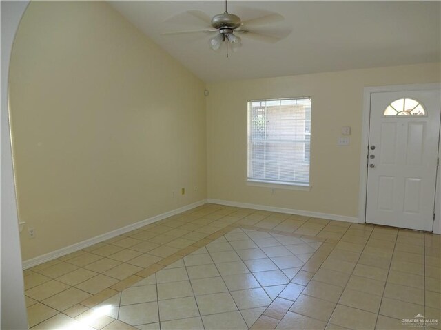 1902 Bahamas Dr, Edinburg, TX 78541 - entryway featuring light tile patterned floors, baseboards, ceiling fan, and lofted ceiling