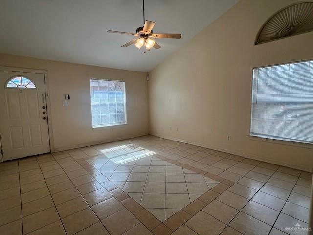 1902 Bahamas Dr, Edinburg, TX 78541 - foyer entrance featuring a ceiling fan, light tile patterned floors, baseboards, and lofted ceiling