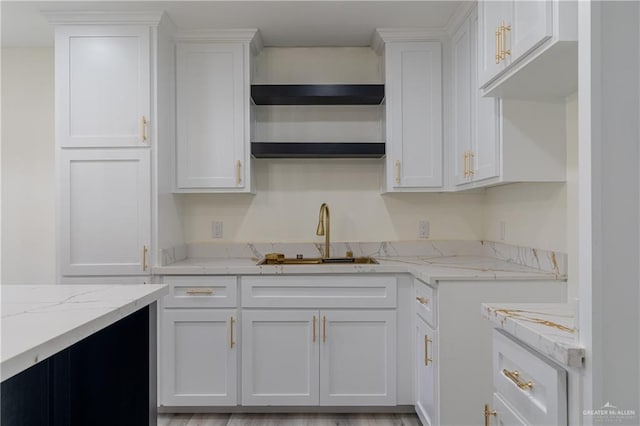 kitchen with sink and white cabinetry