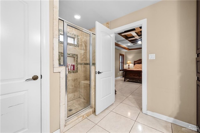 bathroom featuring a shower with shower door and tile patterned floors