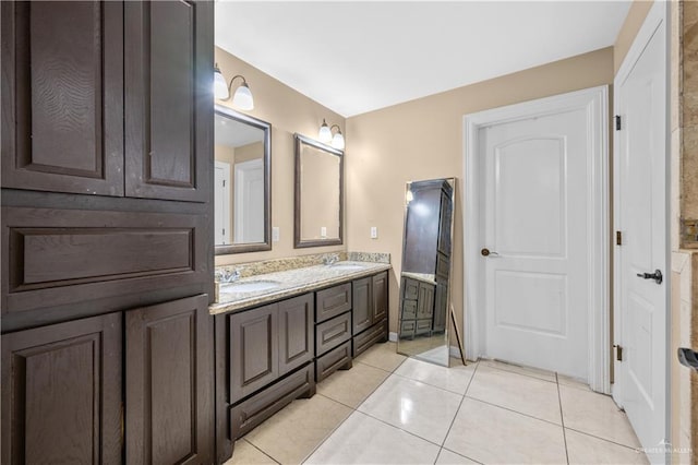 bathroom with tile patterned flooring and vanity