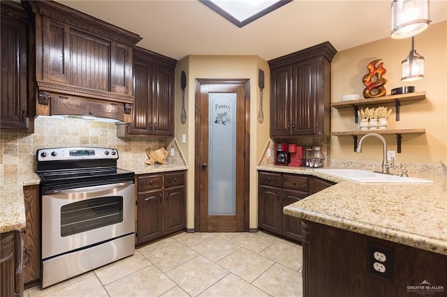 512 Frost Proof Dr, Weslaco, TX 78599 - kitchen featuring stainless steel range with electric cooktop, a sink, dark brown cabinets, and tasteful backsplash