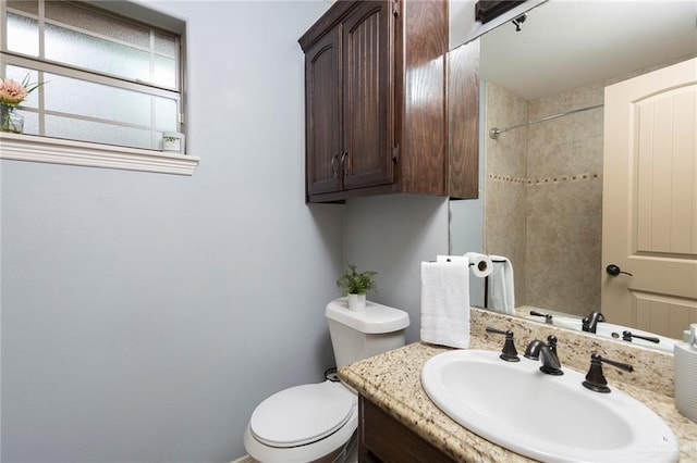 512 Frost Proof Dr, Weslaco, TX 78599 - full bathroom with vanity, toilet, and a shower