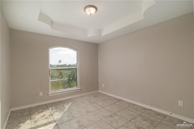 5524 Xenops Ave, Mcallen, TX 78504 - unfurnished room with a tray ceiling and baseboards