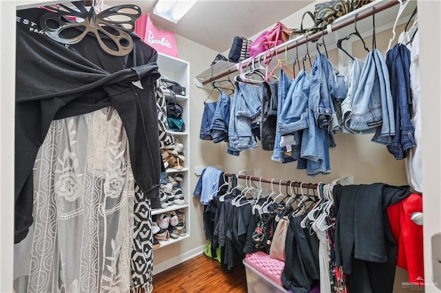 walk in closet featuring wood finished floors