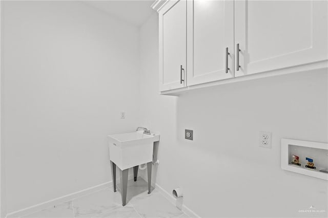 laundry area featuring cabinet space, baseboards, hookup for a washing machine, marble finish floor, and electric dryer hookup