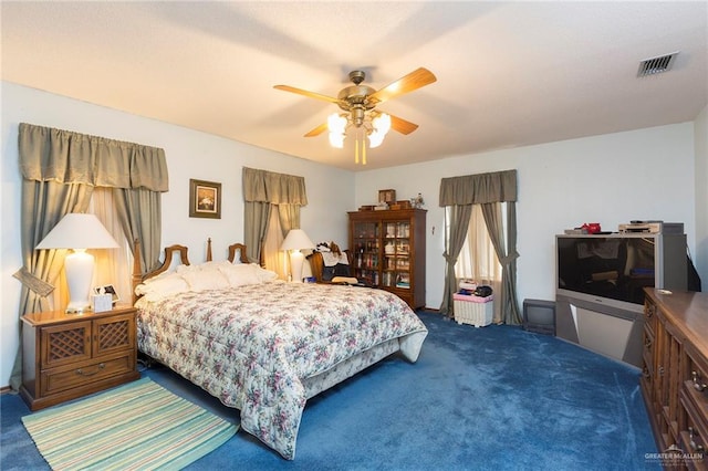 carpeted bedroom with ceiling fan