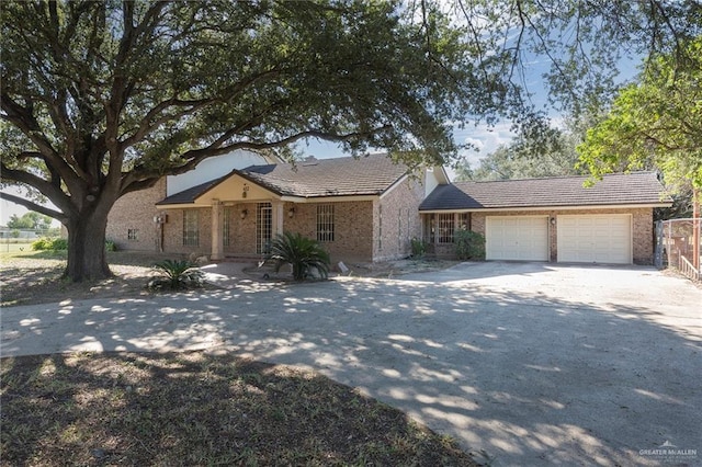 single story home featuring a garage