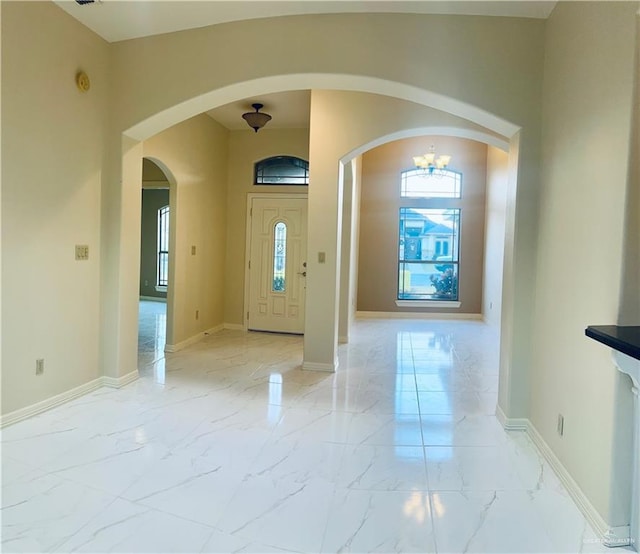 foyer featuring a notable chandelier