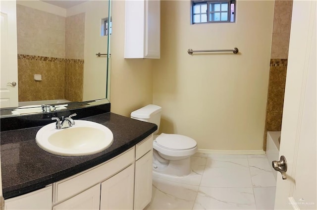 full bathroom featuring vanity, toilet, and tiled shower / bath combo