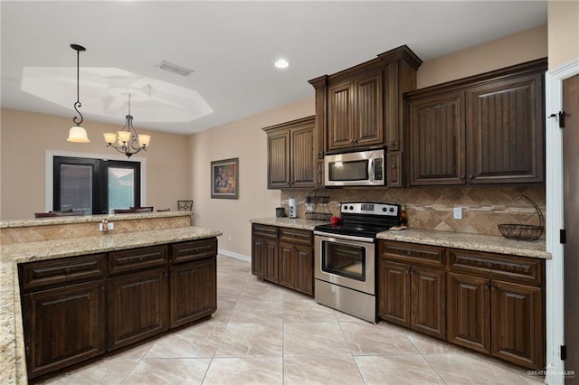 kitchen with visible vents, an inviting chandelier, stainless steel appliances, dark brown cabinets, and backsplash