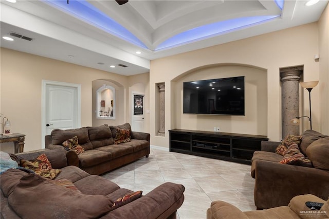 living area with tile patterned flooring, recessed lighting, and visible vents