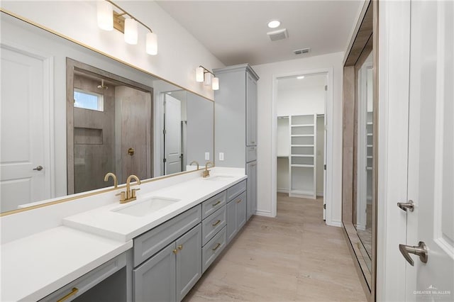 2712 E Burberry Dr, Edinburg, TX 78542 - bathroom featuring a sink, visible vents, and double vanity