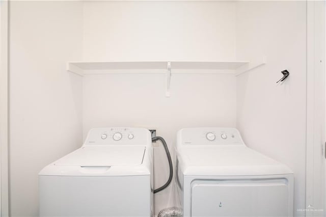 laundry room featuring washing machine and dryer