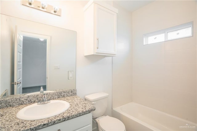 full bathroom featuring vanity, toilet, and tiled shower / bath