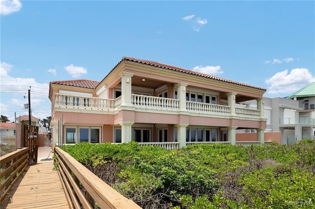 rear view of house with a balcony