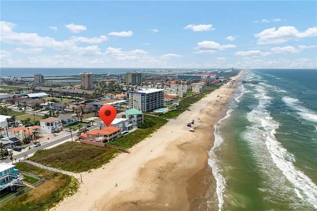 drone / aerial view with a beach view and a water view