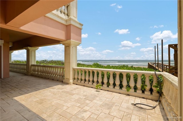 view of patio featuring a water view