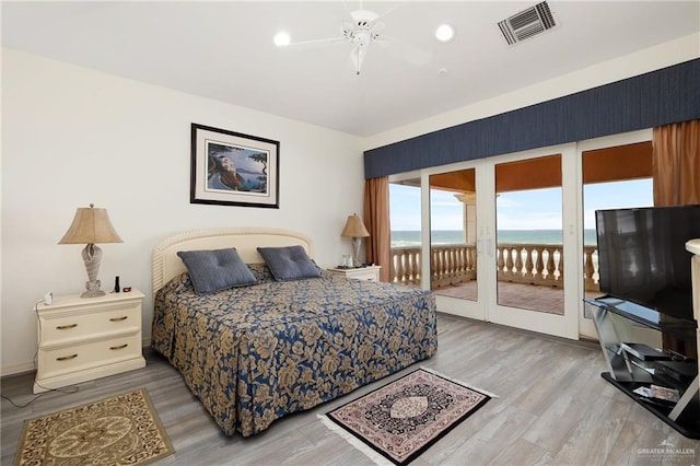 bedroom with ceiling fan, access to exterior, and light wood-type flooring