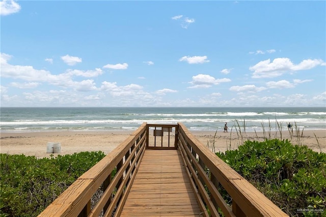 view of community with a water view and a view of the beach