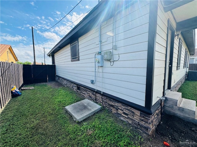 view of property exterior featuring a yard