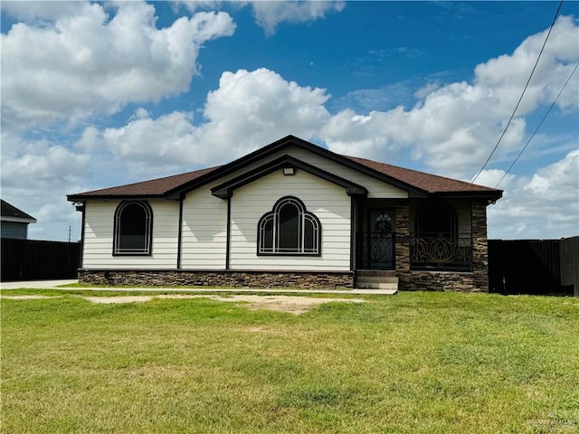 ranch-style house with a front lawn