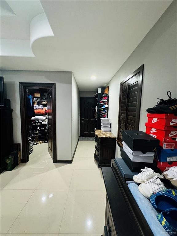 hallway with light tile patterned floors