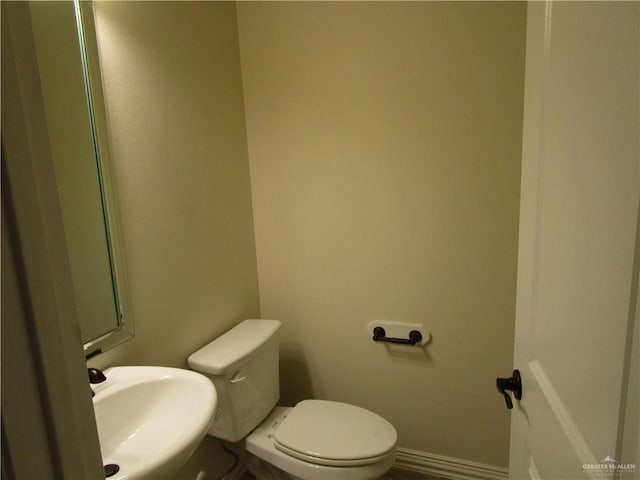 bathroom with sink and toilet