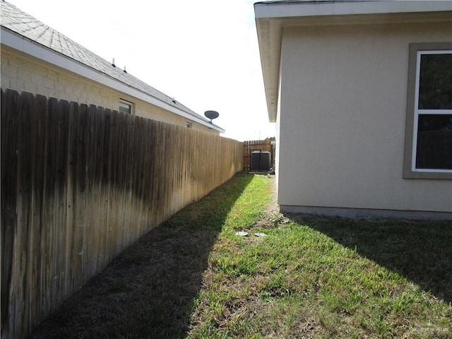 view of yard with central air condition unit