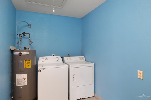 laundry area with washer and dryer and water heater