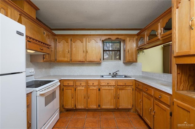 kitchen featuring sink, premium range hood, a textured ceiling, white appliances, and light tile patterned flooring