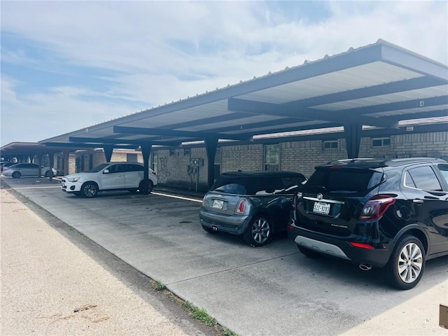 view of parking / parking lot with a carport