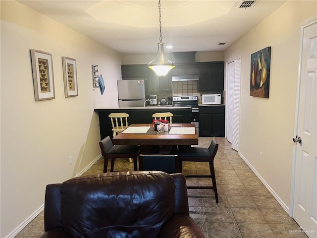 dining room with tile patterned flooring