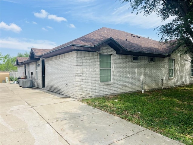 view of side of property with central AC