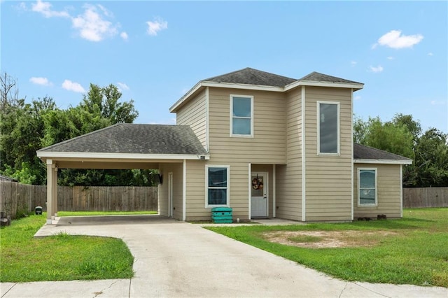 front of property with a front lawn and a carport