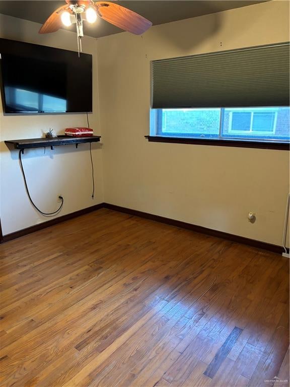 interior space with ceiling fan and hardwood / wood-style flooring