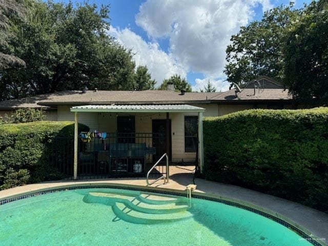 view of swimming pool with a patio area