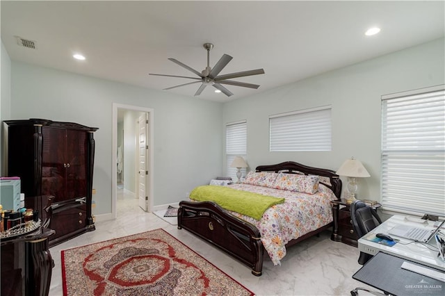 bedroom featuring ceiling fan and ensuite bathroom