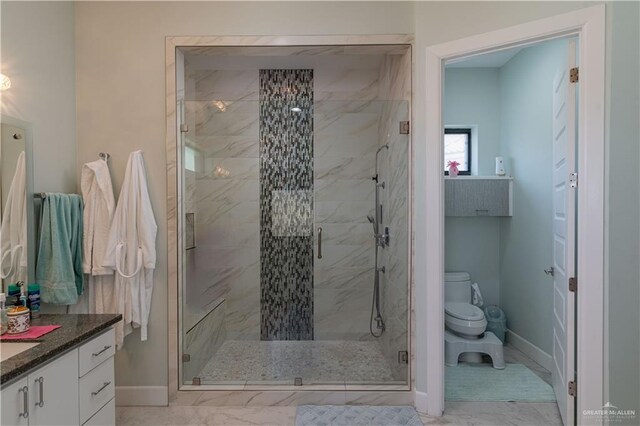 bathroom with walk in shower, vanity, and toilet