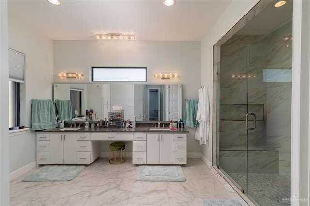 bathroom featuring vanity and an enclosed shower