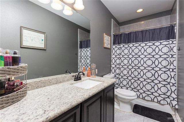 bathroom with toilet, tile patterned flooring, shower / bath combo with shower curtain, and vanity