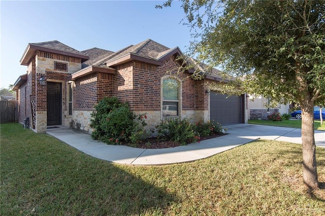 view of front facade with an attached garage, brick siding, stone siding, driveway, and a front lawn