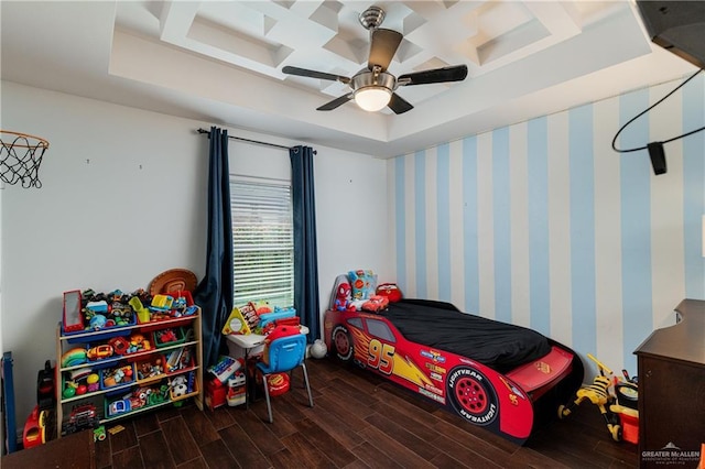 bedroom with wallpapered walls, a ceiling fan, coffered ceiling, and wood finished floors