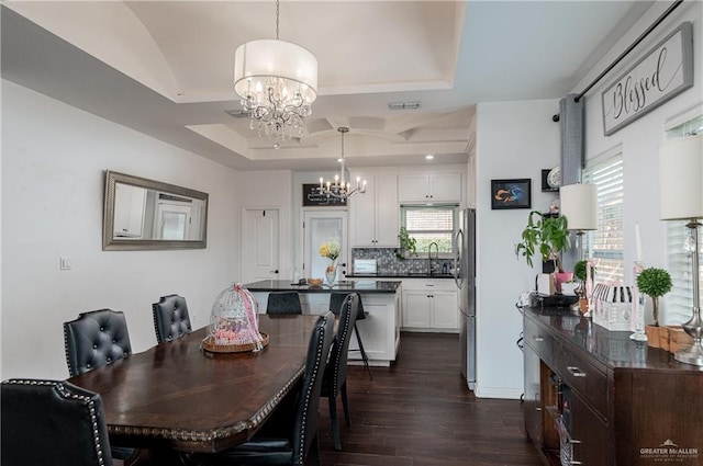 dining space featuring an inviting chandelier, visible vents, dark wood finished floors, and a wealth of natural light