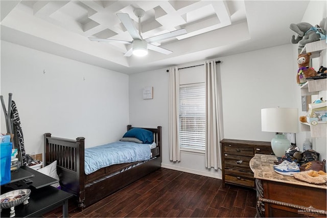 bedroom featuring ceiling fan, coffered ceiling, wood finished floors, and baseboards