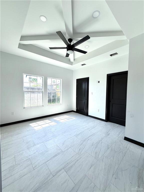 204 S 83rd St, Edinburg, TX 78542 - unfurnished room featuring baseboards, a raised ceiling, a ceiling fan, and recessed lighting
