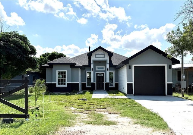 204 S 83rd St, Edinburg, TX 78542 - view of front facade with a garage, driveway, a front lawn, and a shingled roof