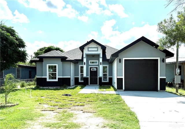 204 S 83rd St, Edinburg, TX 78542 - view of front of house featuring a garage, driveway, a front yard, a shingled roof, and stucco siding