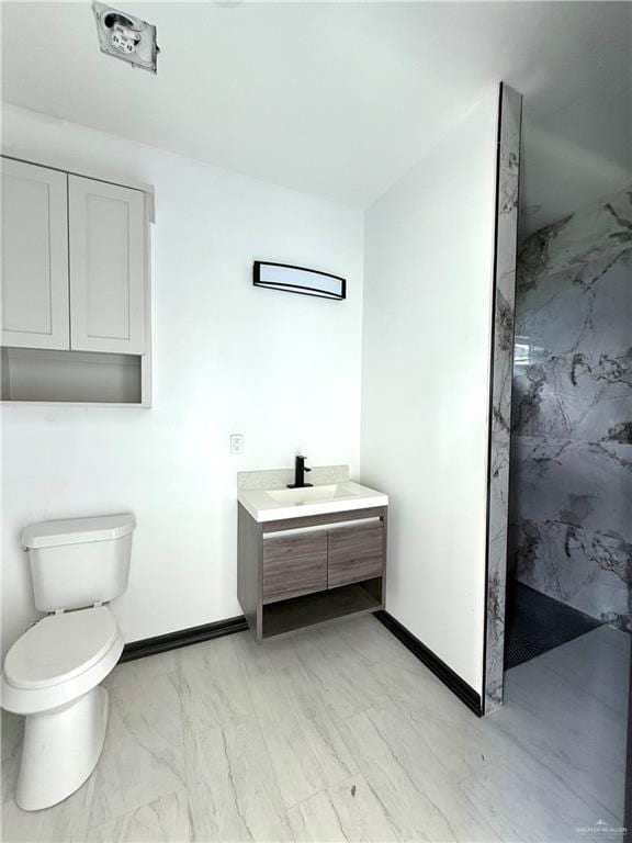204 S 83rd St, Edinburg, TX 78542 - bathroom with a marble finish shower, toilet, baseboards, and vanity