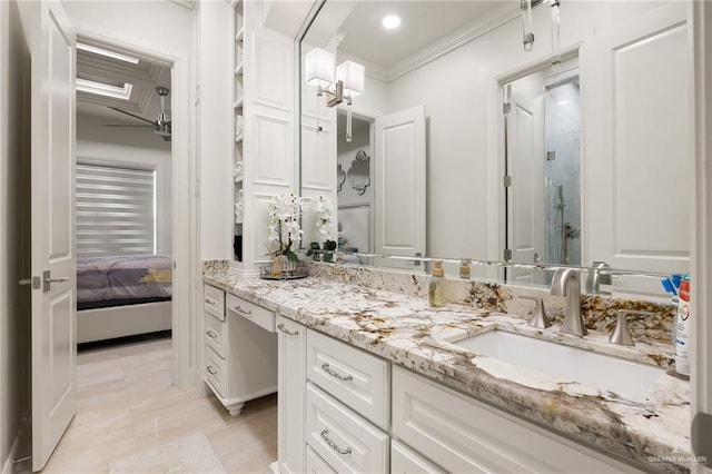 bathroom featuring ensuite bathroom, ornamental molding, a shower stall, vanity, and tile patterned flooring